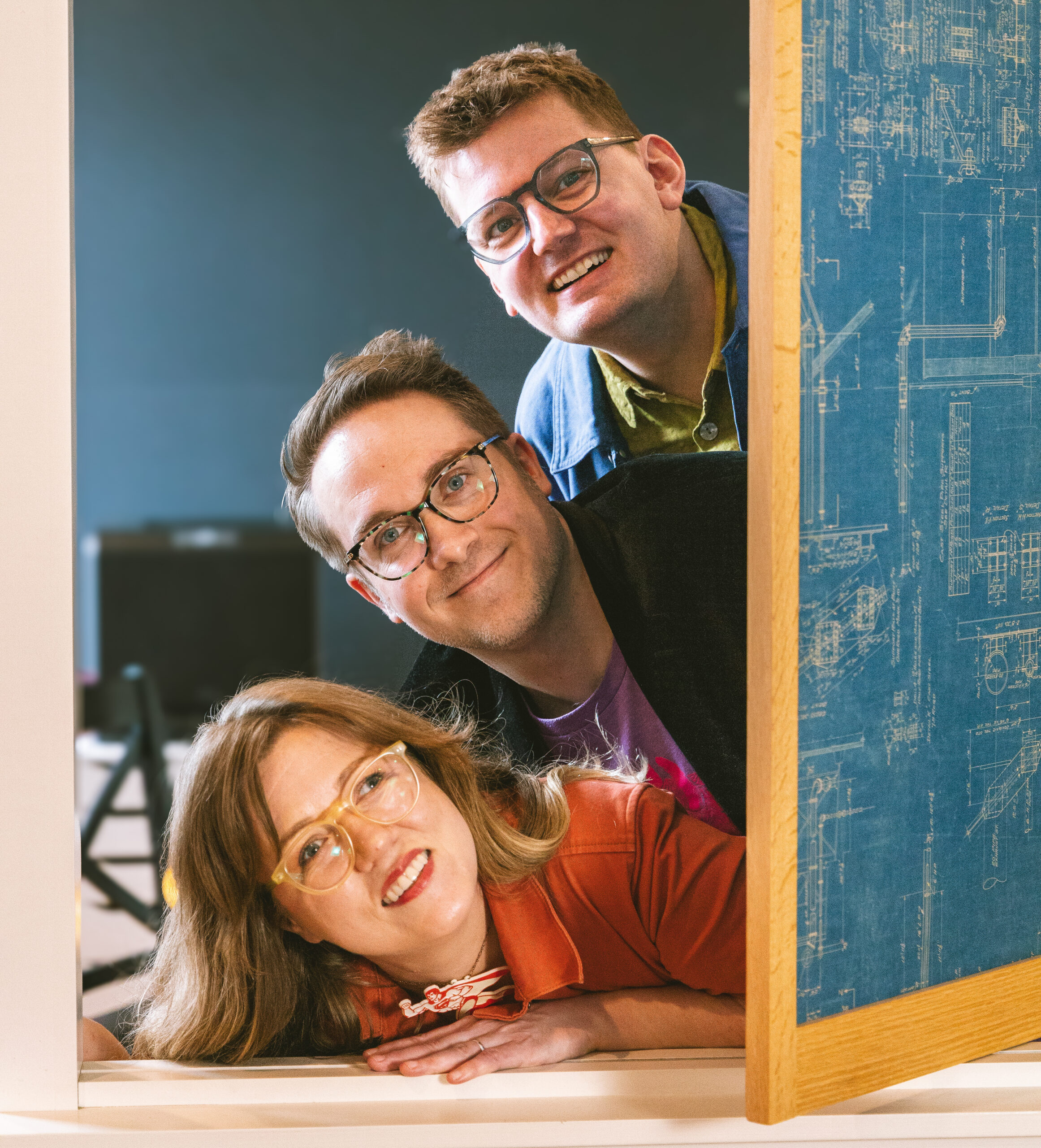Pair of Ducks creative team (left to right): Justin Gibson, Staci Gibson, and Derek Brouwer wearing Daylight Brand knit hats